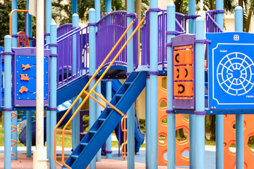 Fototapeta na wymiar Colorful children Slider House in the Playground view