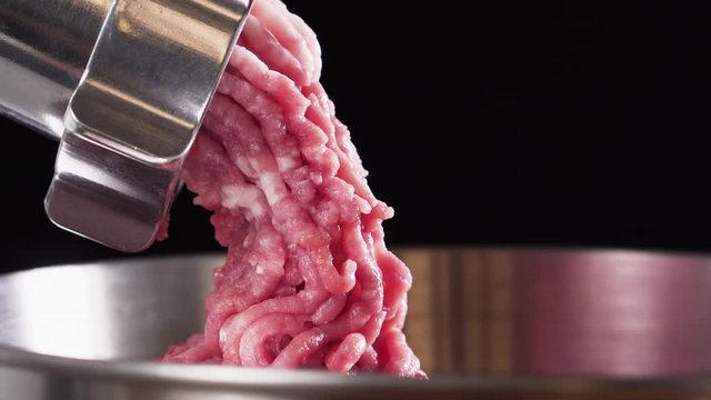 Meat grinder, grinds the meat into minced meat. Minced pork.