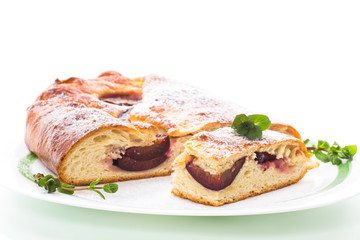 sweet baked homemade plum cake with icing sugar