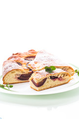 sweet baked homemade plum cake with icing sugar