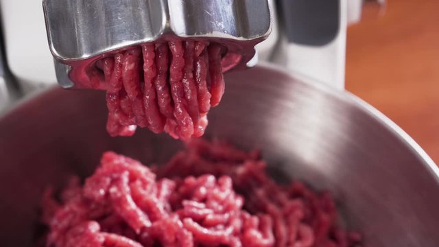 Meat grinder, grinds the meat into minced meat. Minced beef.