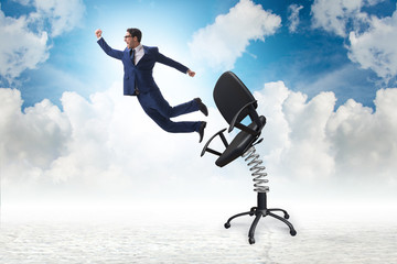 Promotion concept with businessman ejected from chair