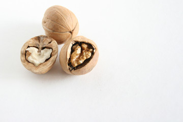 Walnuts on white table.  Food background with copyspace