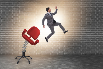 Promotion concept with businessman ejected from chair