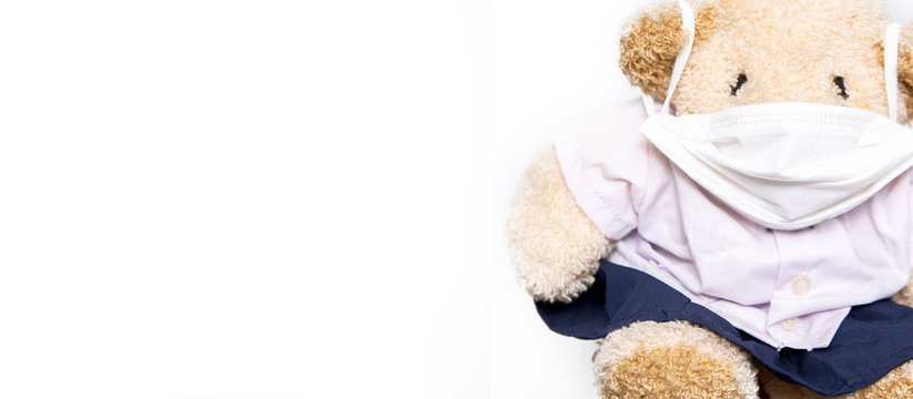 toy bears wear surgical mask for social distance away from pandemic corona virus or covid-19 during quarantine period. Health and medicine concept - Powered by Adobe