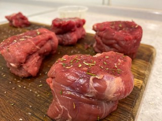 raw meat on a cutting board