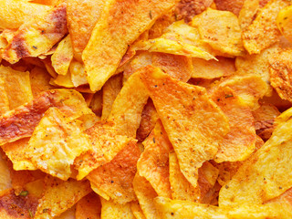 Homemade Chips. A pile of crisps close-up. Junk food.