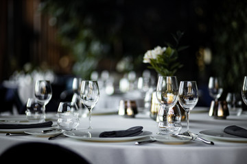 Beautiful table set for an event party or wedding reception . restaurant interior