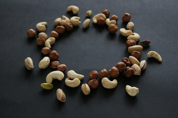 Nuts in bowl on white background, top view with copyspace.  Assorted mixed nuts  isolated on table.