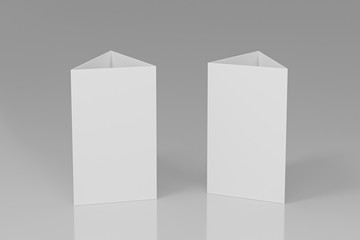 Promotional table talker isolated on white background, mockup template paper tri-fold vertical triangle cards with reflections. white sheets front & left and right view. 3d render © Kakabe