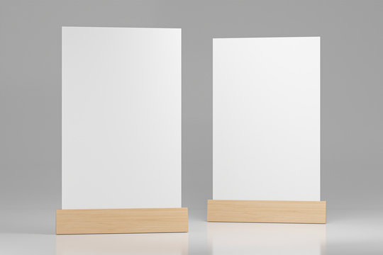 Menu frame standing on wood table isolated on white background with clipping path. space for text marketing promotion Bar restaurant ,Stand for booklets with white sheets of paper. 3d render