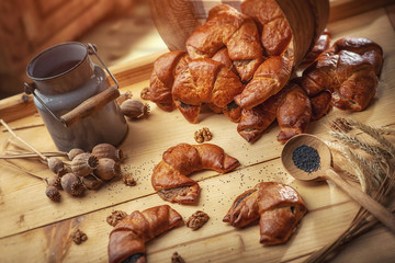 Breakfast poppy cakes on the breadboard with poppy seeds, sweet baked dessert in rustic style