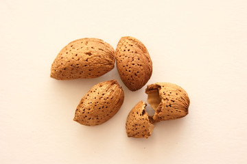 Almond nuts on white background, top view with copyspace.  