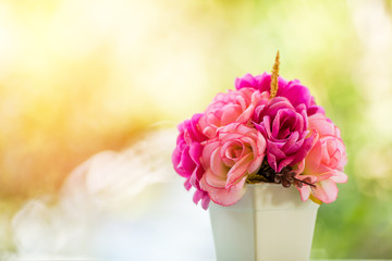 bouquet roses flower in jar close up on blur green leave background 