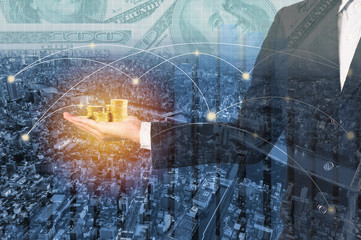 Double exposure businessman and golden money on city and network connection background