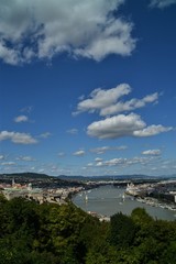 Budapest with the Danube seen from above on a summer day with a blue sky and white clouds
