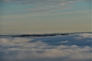 hill in zurich comes out of the sea of fog