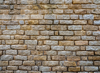 Ancient wall built with stones of various types and thickness