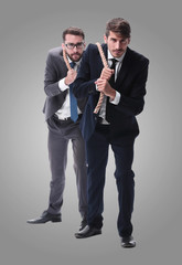 full length . two businessmen pulling a long rope.