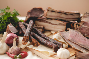 cutting out meat . boiled pork . smoked product . kitchen herbs