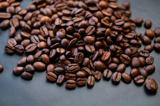 coffee beans are on a black background. © kristina