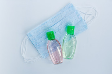 Bottle of hand sanitizer, hand disinfecting gel and surgical mask