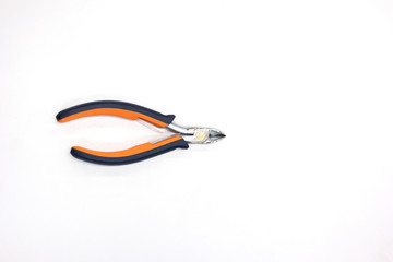 Single used rubber handle wire cutter clipper top view isolated on gray work table