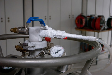 Frozen pipes and valves on high pressure nitrogen tank in a science lab