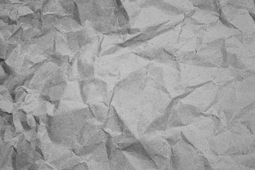 Crumpled recycled paper. Black and white background image.