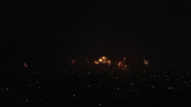Aerial view of fireworks in a small town in europe during new years evening
