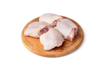 Raw chicken thighs isolated on white background.