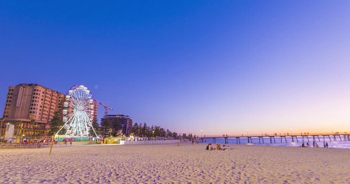 People at popular tourist beach during late evening, Time lapse