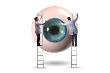 Doctor examining giant eye in medical concept