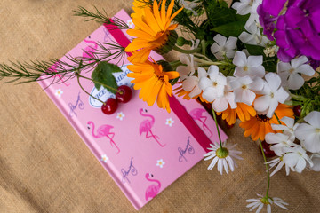 notepad and bouquet of flowers