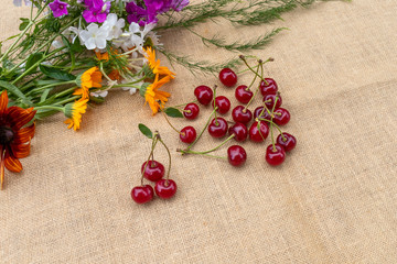 ripe cherries and bright flowers