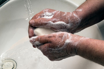 Handwashing to prevent viral infection.