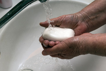 Handwashing to prevent viral infection.