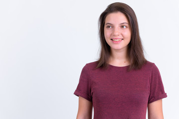 Obraz premium Portrait of happy young beautiful woman thinking and looking up