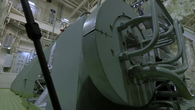 Fancifully bended pipes of main engine of ship