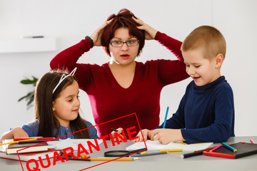 Home office. Working from home vs. Mom with two kids Work on the Internet on a laptop at home. quarantine. Corona Virus.