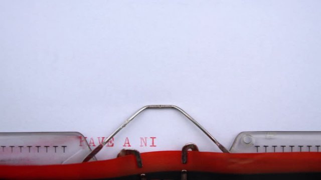 Have a nice weekend - phrase printed on an old typewriter in red letters, close up. vintage inscription