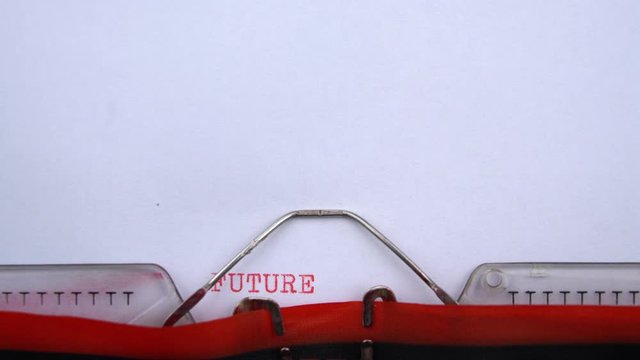 Future - word printed on an old typewriter in red letters, close up. vintage inscription