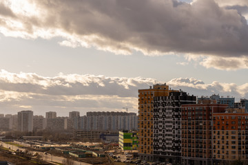 new residential quarter of the metropolis with a beautiful cloudy sky at dusk from a height