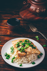 Oyakodon. Japanese rice dish with chicken, egg, sliced scallion
