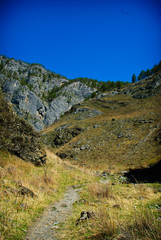 Rocky mountain trail leading to the mountains of Altai