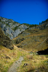 Fototapeta na wymiar Rocky mountain trail leading to the mountains of Altai