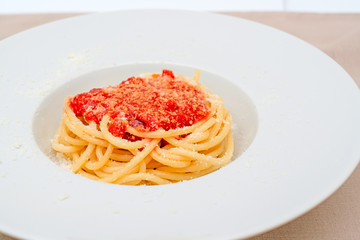 spaghetti with tomato sauce and parmesan