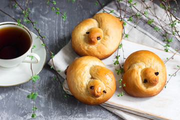 Traditional spring bird-shaped lean buns coated with sweet syrup.