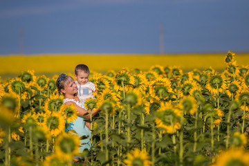 Mom and son in sunflowers		