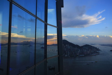 dusk of hong kong with the office window reflection